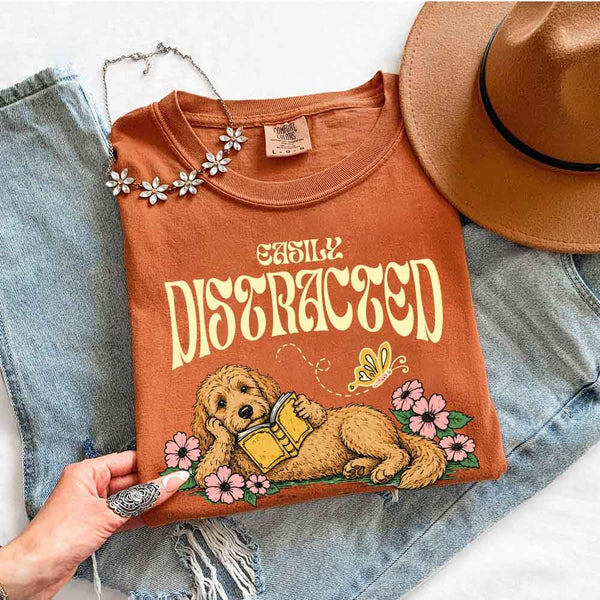 May include Dog & Book Lover Comfort Colors t-shirt with reader and dog graphic, relaxed unisex fit, and garment-dyed cotton
