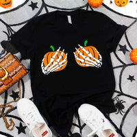 May include Halloween graphic with two pumpkins being grabbed by white skeleton hands on black background – spooky funny design.