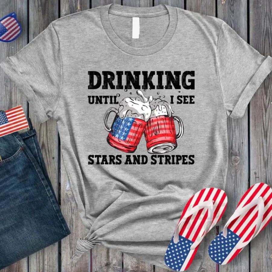 May include Drinking Until I See The Stars And Stripes 4th of July graphic tee with patriotic design and relaxed fit