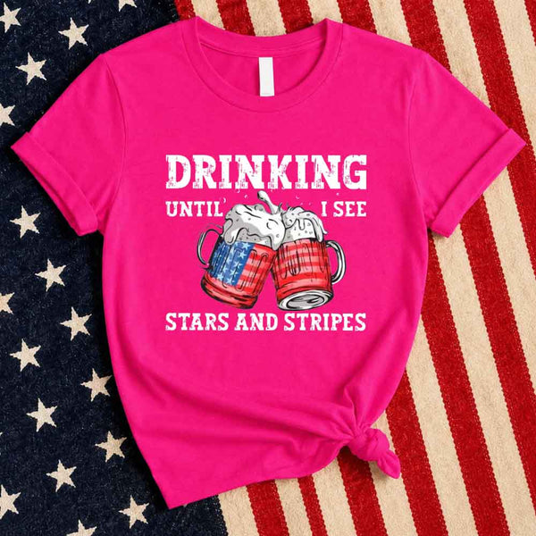 May include Drinking Until I See The Stars And Stripes 4th of July graphic tee with patriotic design and relaxed fit