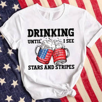 May include Drinking Until I See The Stars And Stripes 4th of July graphic tee with patriotic design and relaxed fit
