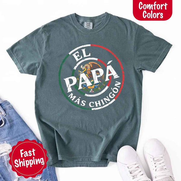 May include bold distressed text that reads “El Papá Más Chingón” over a circular Mexican flag-inspired design with an eagle emblem, celebrating proud and confident fatherhood with cultural pride.