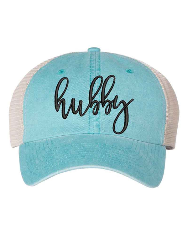 May include an embroidered pigment-dyed trucker hat with mesh back, featuring “Wifey” or “Hubby” text, designed as a casual and stylish gift for spouses or anniversaries.