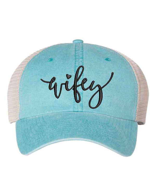 May include an embroidered pigment-dyed trucker hat with mesh back, featuring “Wifey” or “Hubby” text, designed as a casual and stylish gift for spouses or anniversaries.