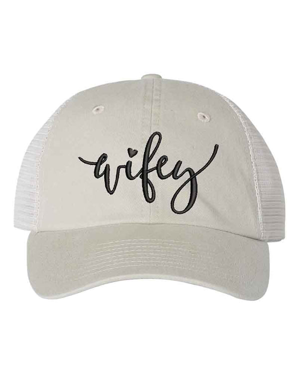 May include an embroidered pigment-dyed trucker hat with mesh back, featuring “Wifey” or “Hubby” text, designed as a casual and stylish gift for spouses or anniversaries.