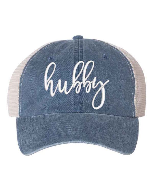 May include an embroidered pigment-dyed trucker hat with mesh back, featuring “Wifey” or “Hubby” text, designed as a casual and stylish gift for spouses or anniversaries.