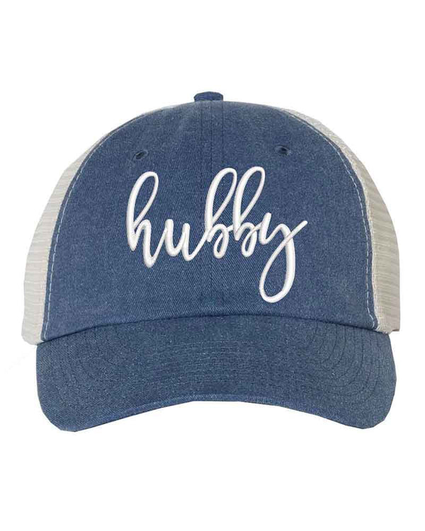 May include an embroidered pigment-dyed trucker hat with mesh back, featuring “Wifey” or “Hubby” text, designed as a casual and stylish gift for spouses or anniversaries.