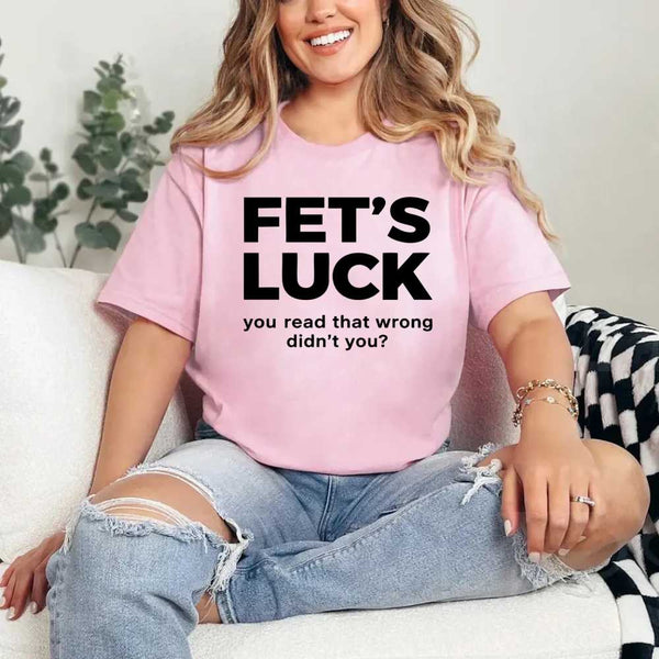 May include a graphic t-shirt featuring the phrase “FET’S LUCK” designed as an optical illusion.