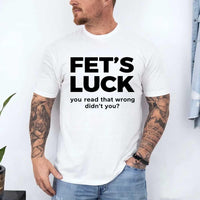 May include a graphic t-shirt featuring the phrase “FET’S LUCK” designed as an optical illusion.