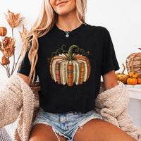 May include a Fall Book Pumpkin Comfort Colors T-Shirt featuring a book and pumpkin design, perfect for readers, book lovers, autumn outfits, and cozy fall gatherings.