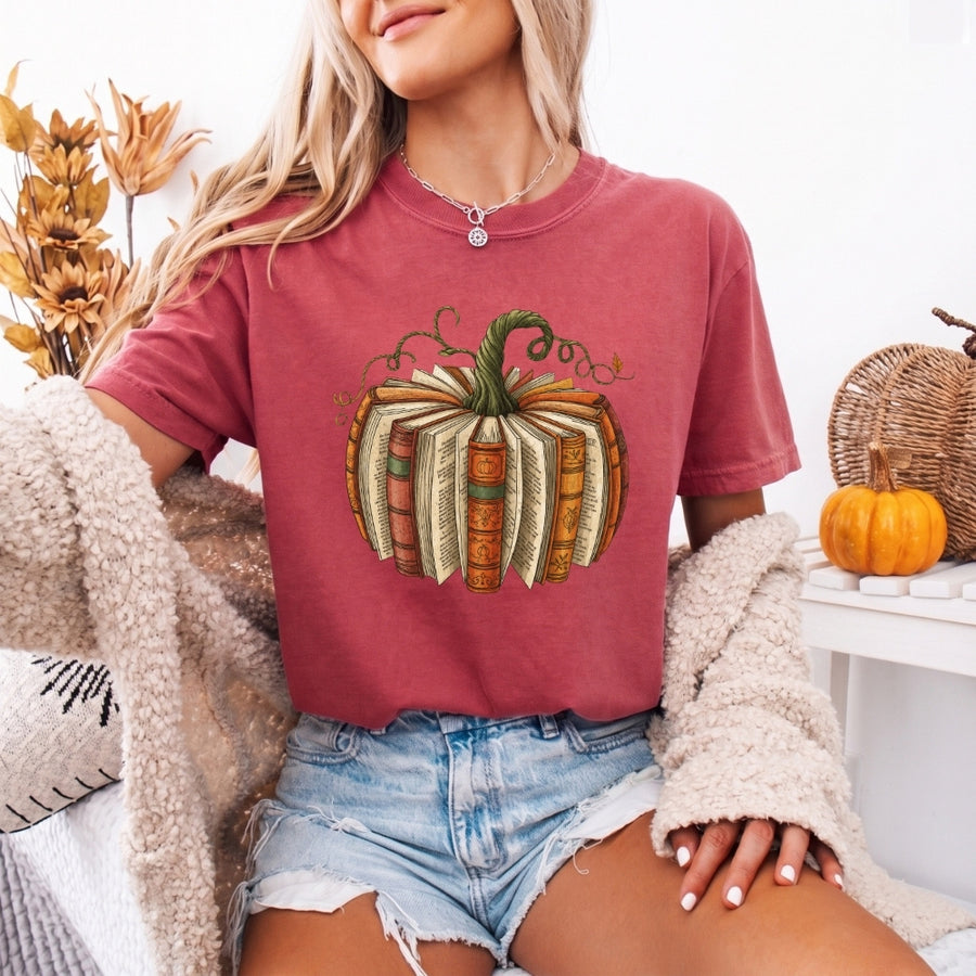 May include a Fall Book Pumpkin Comfort Colors T-Shirt featuring a book and pumpkin design, perfect for readers, book lovers, autumn outfits, and cozy fall gatherings.