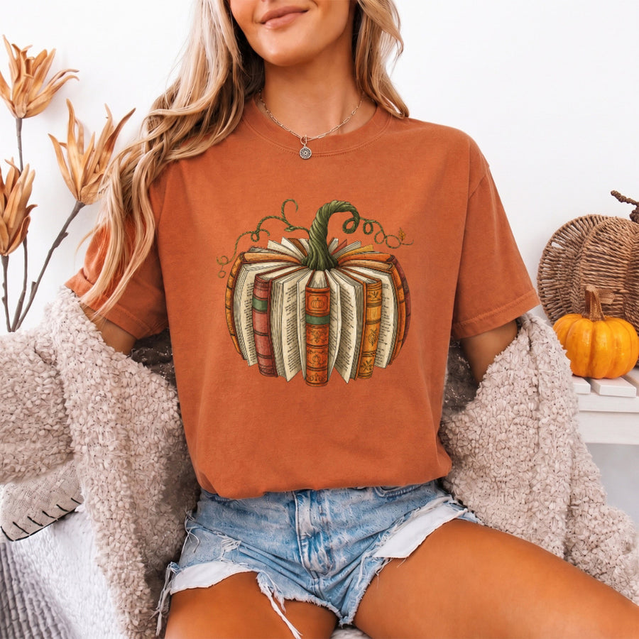 May include a Fall Book Pumpkin Comfort Colors T-Shirt featuring a book and pumpkin design, perfect for readers, book lovers, autumn outfits, and cozy fall gatherings.