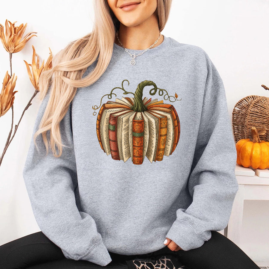 May include Fall Book Pumpkin sweatshirt with cozy book and pumpkin graphic, classic unisex crewneck, and soft fleece fabric
