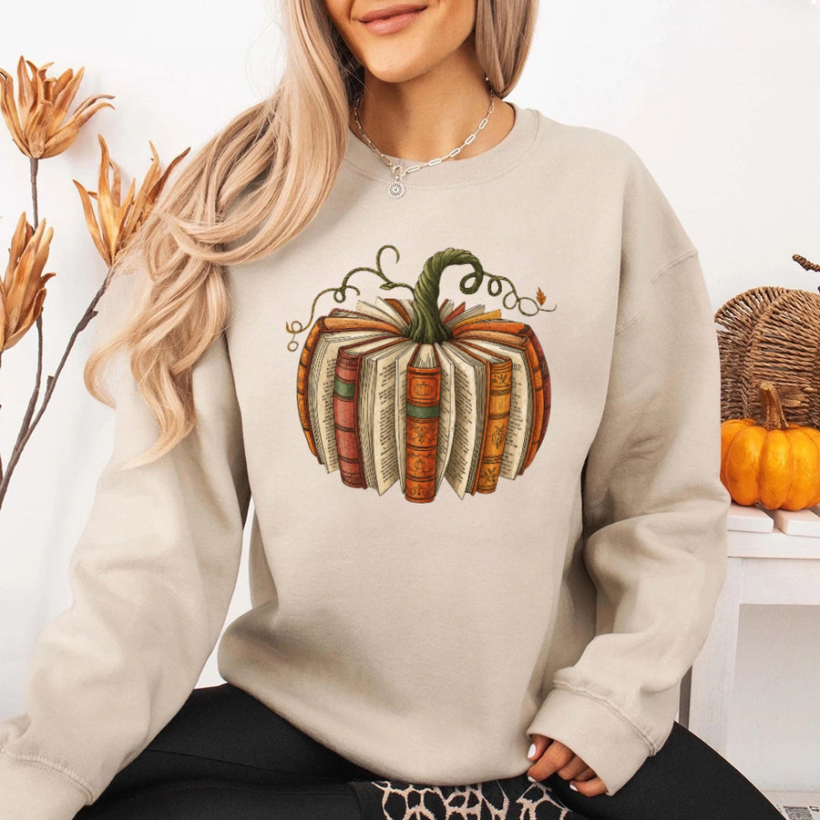 May include Fall Book Pumpkin sweatshirt with cozy book and pumpkin graphic, classic unisex crewneck, and soft fleece fabric