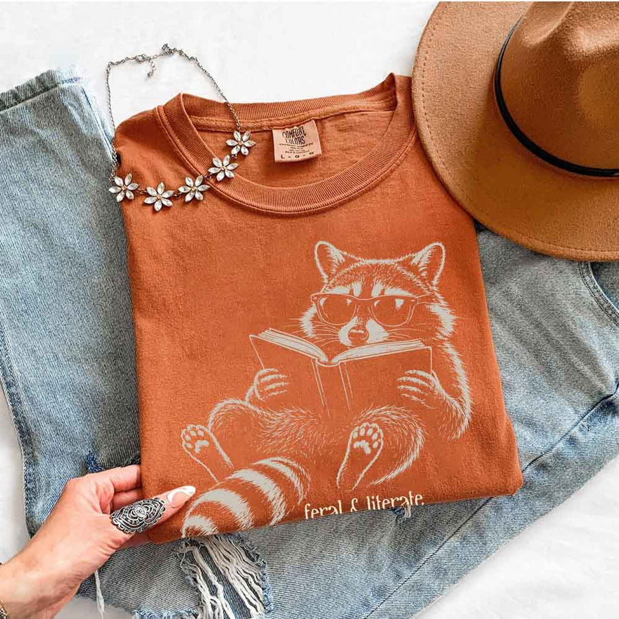 May include Feral & Literate Comfort Colors t-shirt with funny book lover graphic, relaxed unisex fit, and garment-dyed cotton