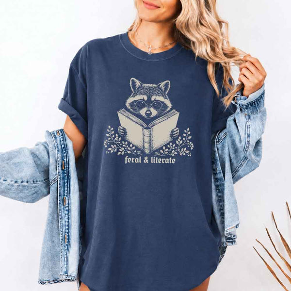 May include Feral & Literate Raccoon Comfort Colors t-shirt with funny book lover graphic, relaxed unisex fit, and garment-dyed cotton