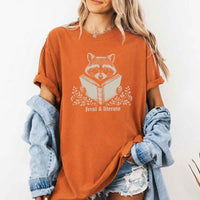 May include Feral & Literate Raccoon Comfort Colors t-shirt with funny book lover graphic, relaxed unisex fit, and garment-dyed cotton