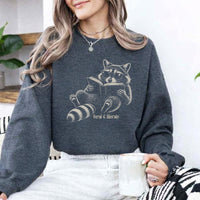 May include a Feral & Literate Raccoon Sweatshirt featuring a playful raccoon illustration and witty book lover statement design.
