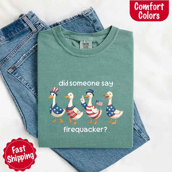Green t-shirt with 'did someone say firequacker?' graphic on blue jeans, featuring Comfort Colors branding.