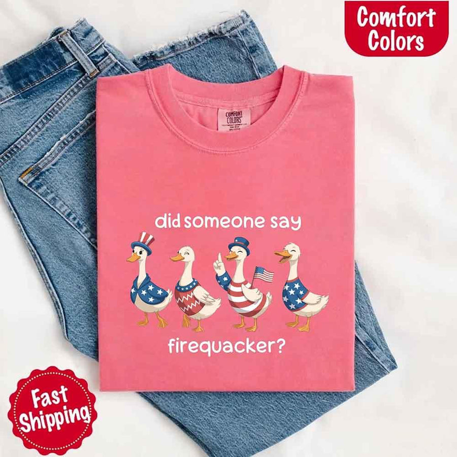 Pink t-shirt with duck graphic and text on a white background