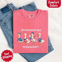 Pink t-shirt with duck graphic and text on a white background
