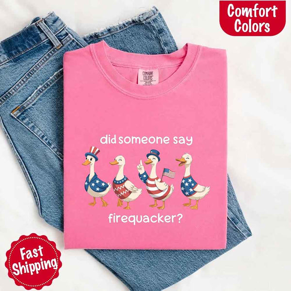 Pink t-shirt with duck graphic and text on a white background