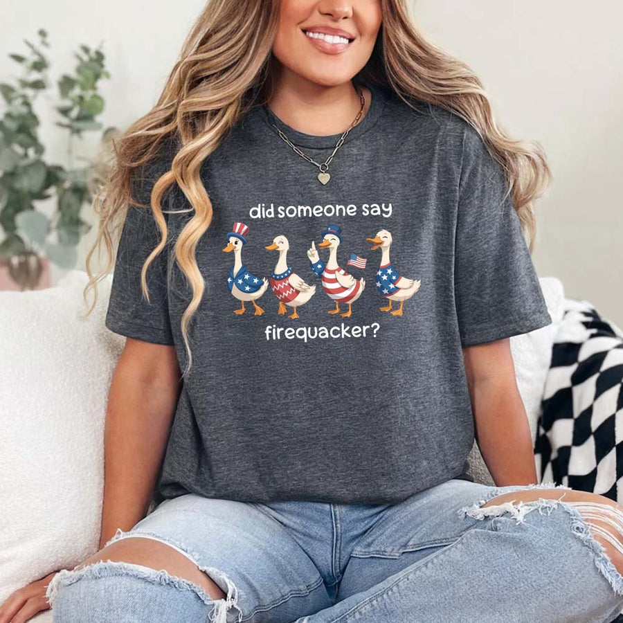 May include a unisex T-shirt with “Firequacker Goose” patriotic 4th of July graphic featuring a funny goose design.