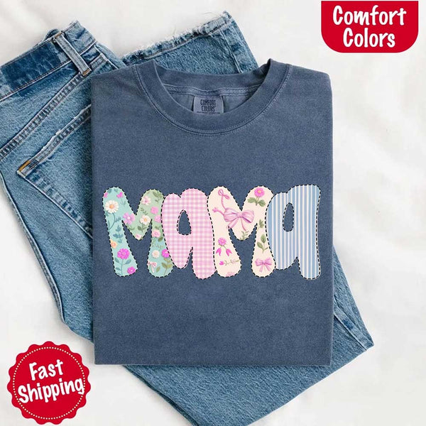 Blue sweatshirt with 'MAMA' text in colorful letters on jeans, featuring Comfort Colors branding.