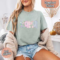 May include the word “Mama” in large playful letters, each filled with different pastel floral, gingham, bow, and striped patterns, creating a sweet and charming patchwork design perfect for moms.