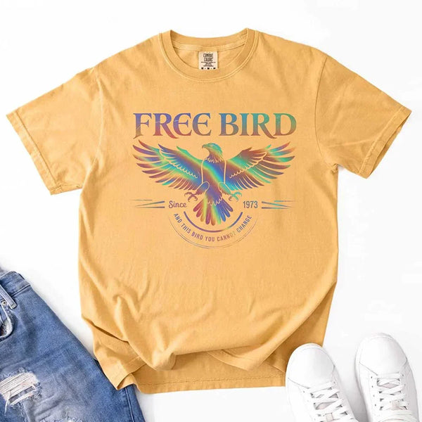 May include a vintage-inspired design with the phrase “Free Bird” on a Comfort Colors tee, channeling classic rock band style and retro music vibes perfect for fans of timeless tunes.