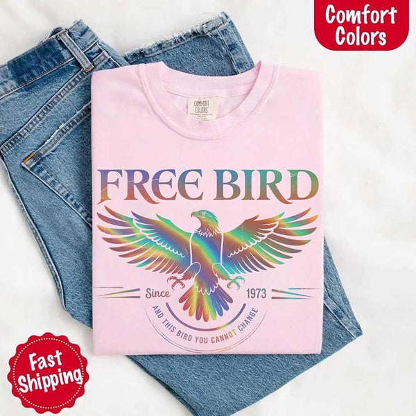 May include a vintage-inspired design with the phrase “Free Bird” on a Comfort Colors tee, channeling classic rock band style and retro music vibes perfect for fans of timeless tunes.