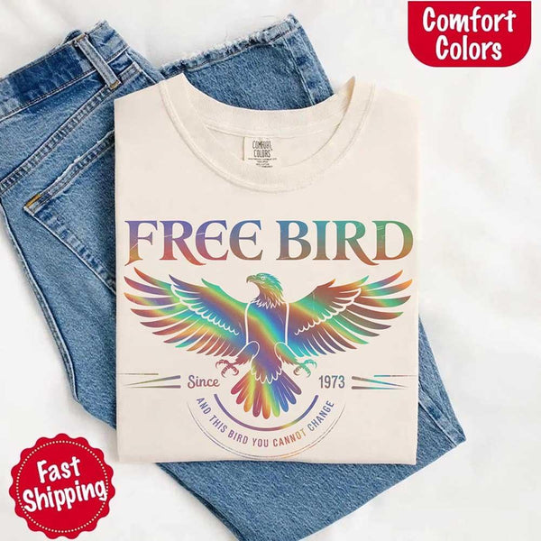 May include a vintage-inspired design with the phrase “Free Bird” on a Comfort Colors tee, channeling classic rock band style and retro music vibes perfect for fans of timeless tunes.