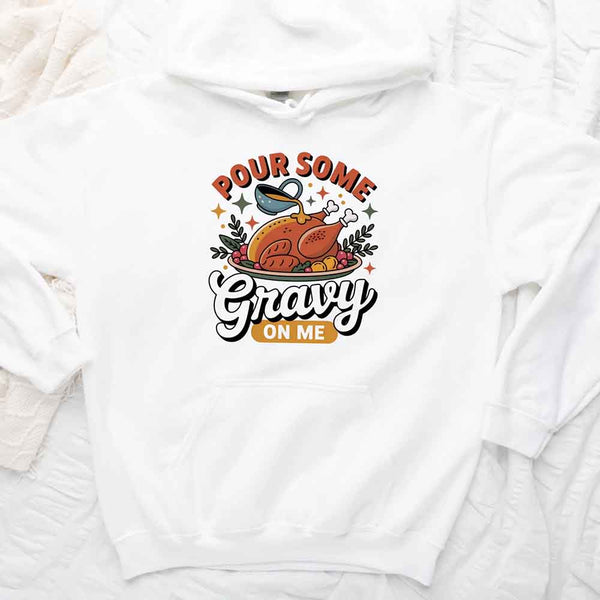 White sweatshirt with a graphic design of a roasted turkey and text 'Pour Some Gravy on Me' on a white background.