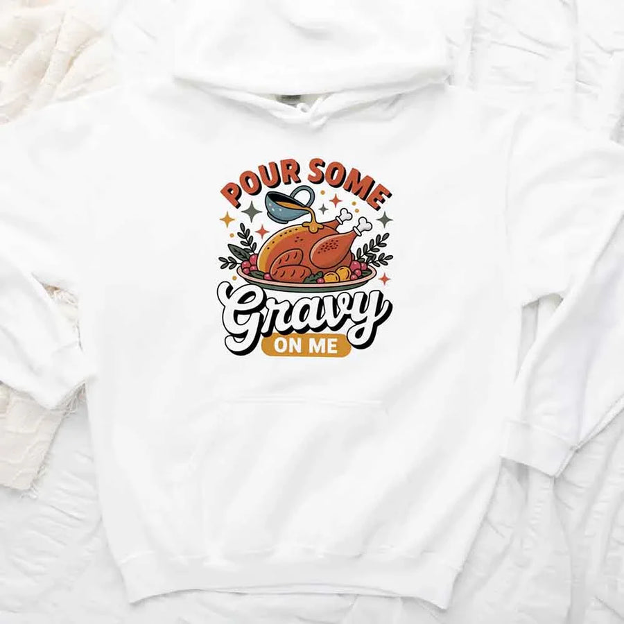 White sweatshirt with a graphic design of a roasted turkey and text 'Pour Some Gravy on Me' on a white background.