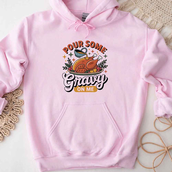 Pink hoodie with a graphic design and text on a light background