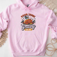 Pink hoodie with a graphic design and text on a light background