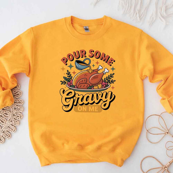 Yellow sweatshirt with a Thanksgiving-themed graphic and text on a white background
