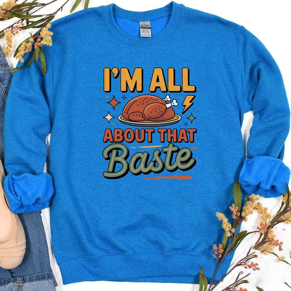 Blue sweatshirt with a graphic of a roasted turkey and text 'I'm All About That Baste' on a white background.