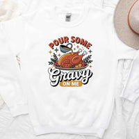 White t-shirt with a graphic of a turkey and text 'Pour Some Gravy On Me' on a white background.