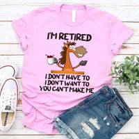 May include a graphic tee with the phrase “I Am Retired I Don’t Have To” printed in a bold, humorous style, featuring clean lettering on a casual shirt meant to highlight a playful retirement message.