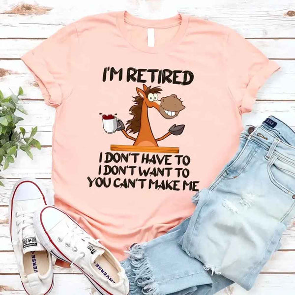 May include a graphic tee with the phrase “I Am Retired I Don’t Have To” printed in a bold, humorous style, featuring clean lettering on a casual shirt meant to highlight a playful retirement message.