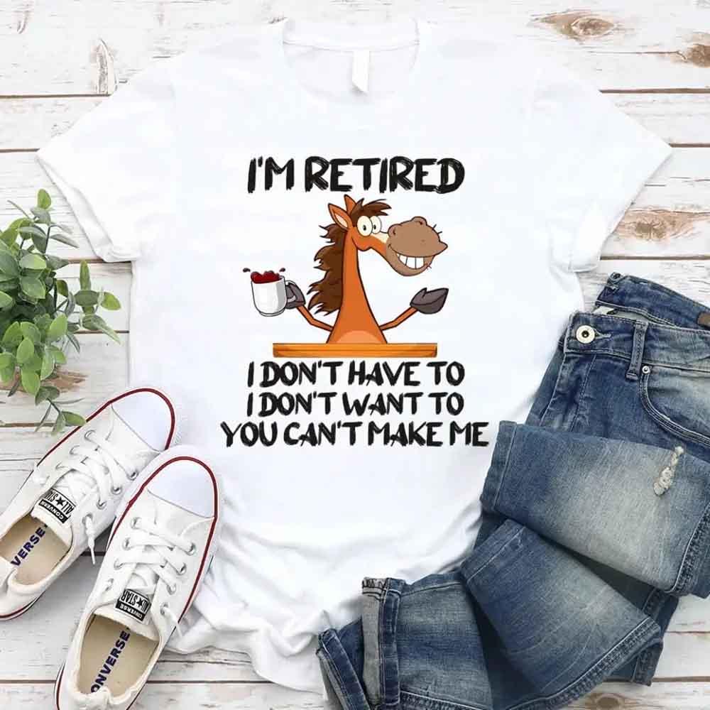 May include a graphic tee with the phrase “I Am Retired I Don’t Have To” printed in a bold, humorous style, featuring clean lettering on a casual shirt meant to highlight a playful retirement message.