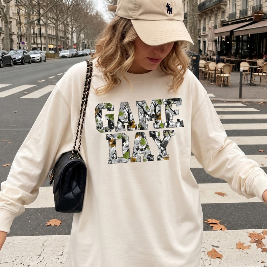 May include a Game Day Camo Print Comfort Colors Unisex Long Sleeve featuring a football-inspired camo print design.