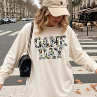 May include a Game Day Camo Print Comfort Colors Unisex Long Sleeve featuring a football-inspired camo print design.