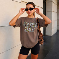 May include a Game Day Comfort Colors Camo Print Football Season Tee featuring a bold camo-inspired game day design.