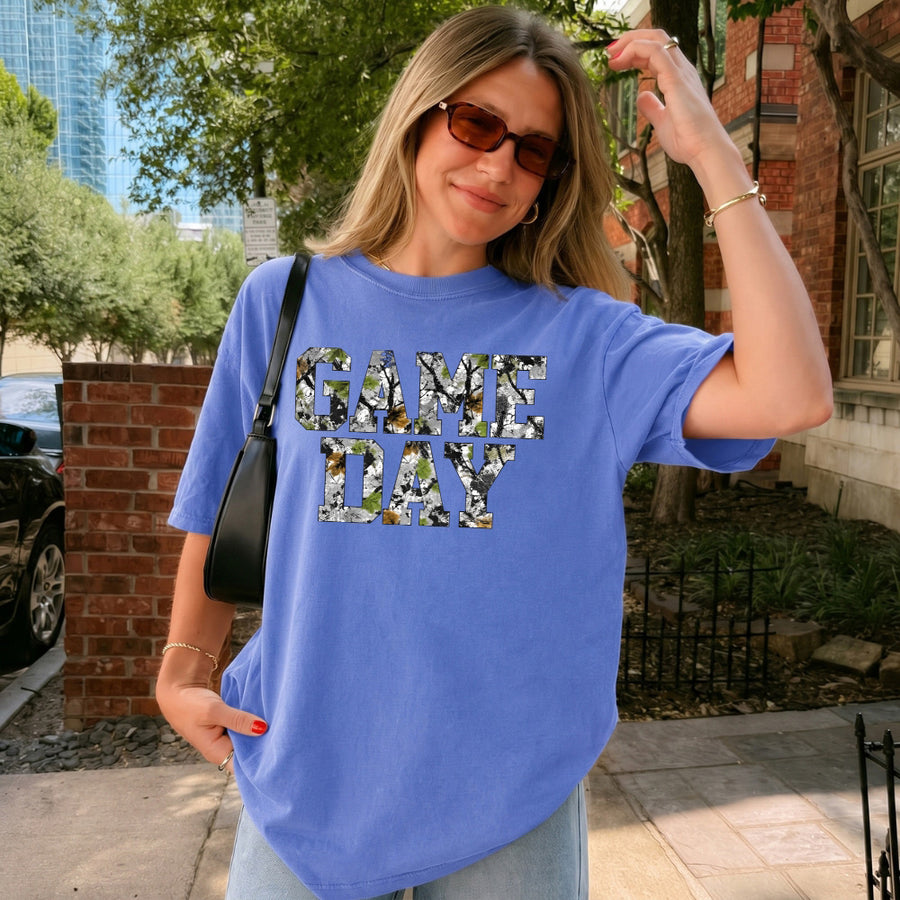 May include a Game Day Comfort Colors Camo Print Football Season Tee featuring a bold camo-inspired game day design.