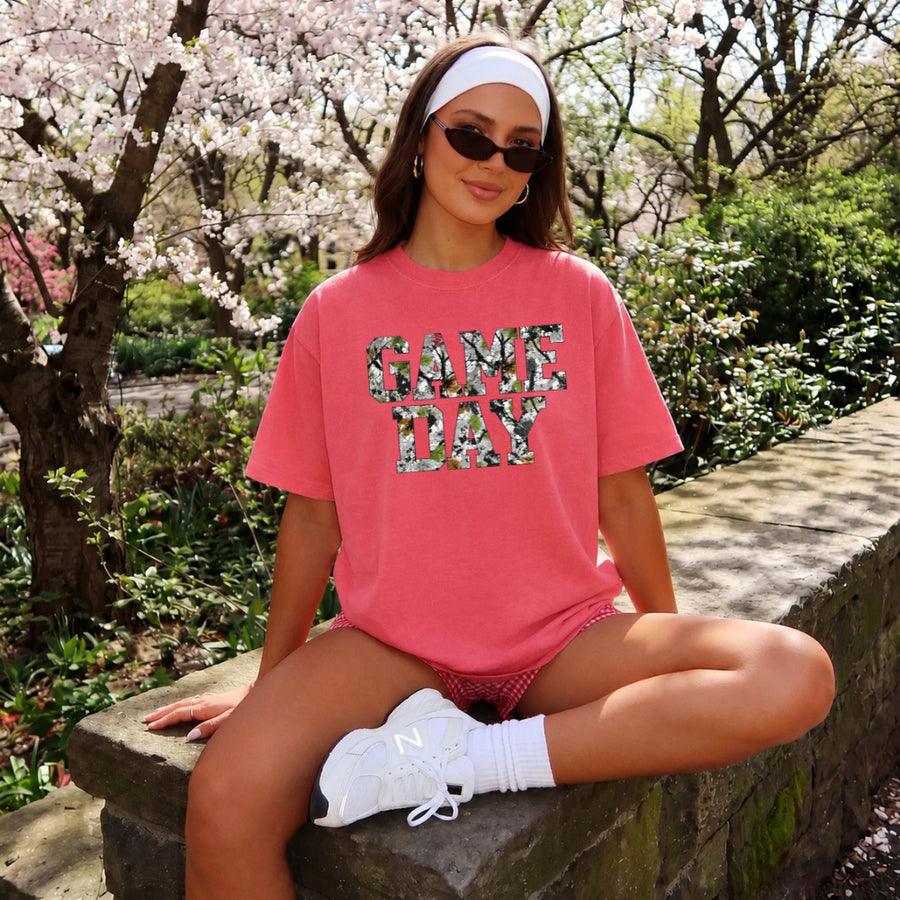 May include a Game Day Comfort Colors Camo Print Football Season Tee featuring a bold camo-inspired game day design.