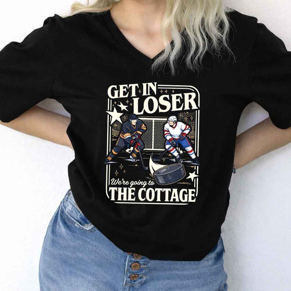 May include Get In Loser, We're Going to the Cottage v-neck tee with hockey romance BookTok graphic and relaxed fit