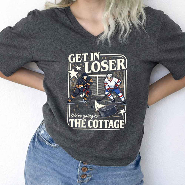 May include Get In Loser, We're Going to the Cottage v-neck tee with hockey romance BookTok graphic and relaxed fit