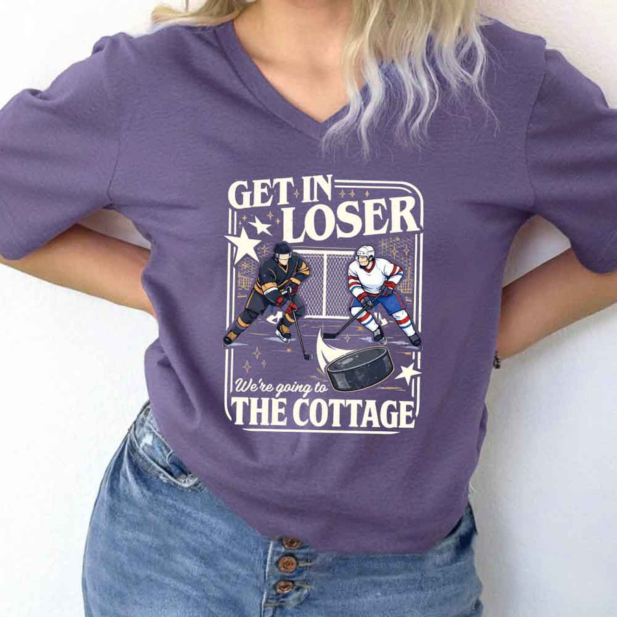 May include Get In Loser, We're Going to the Cottage v-neck tee with hockey romance BookTok graphic and relaxed fit